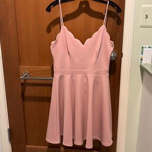 Pink skater dress with scalloped edges